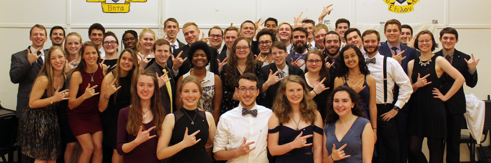 Members of the Kappa Kappa Psi fraternity pose before a social event.