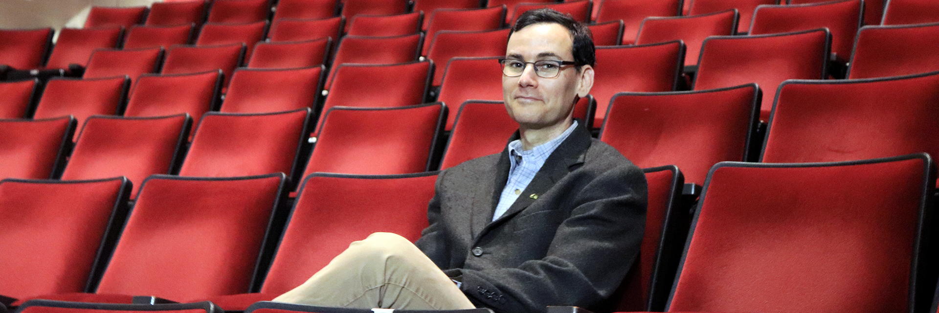 Jason Freeman, Chair of the School of Music, seated at the Ferst Center for the Arts.