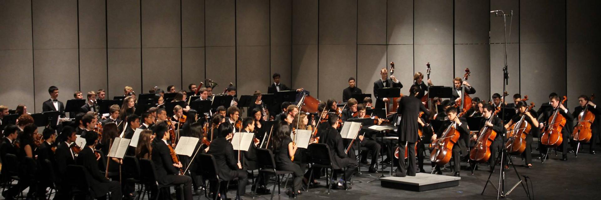 The Georgia Tech Symphony Orchestra performing on stage at the Ferst Center for the Arts.
