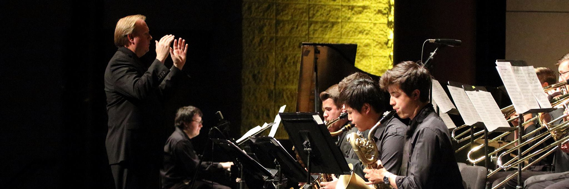 Chip Crotts directing a jazz ensemble during a concert.
