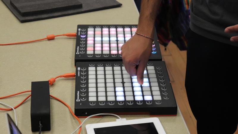 Student plays with a push board