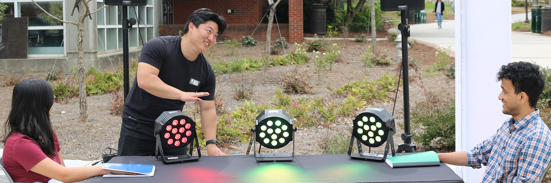 Timothy Min demonstrates his project at Georgia Tech Arts Plaza