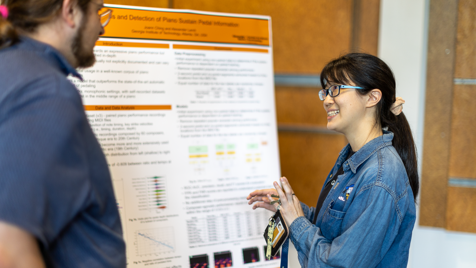 Joann Ching explaining her research at a poster show
