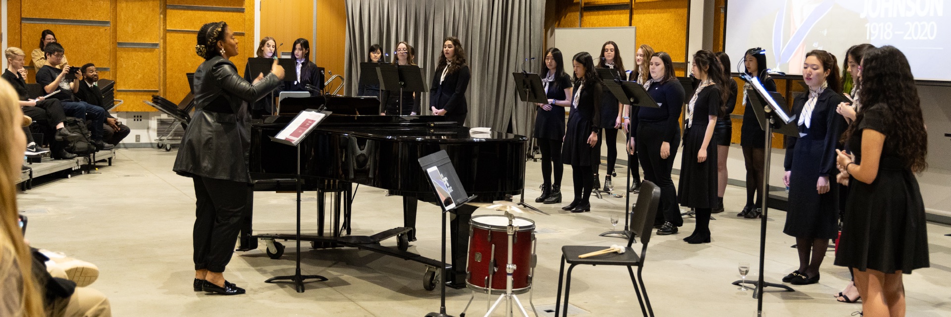A picture of the treble choir performing