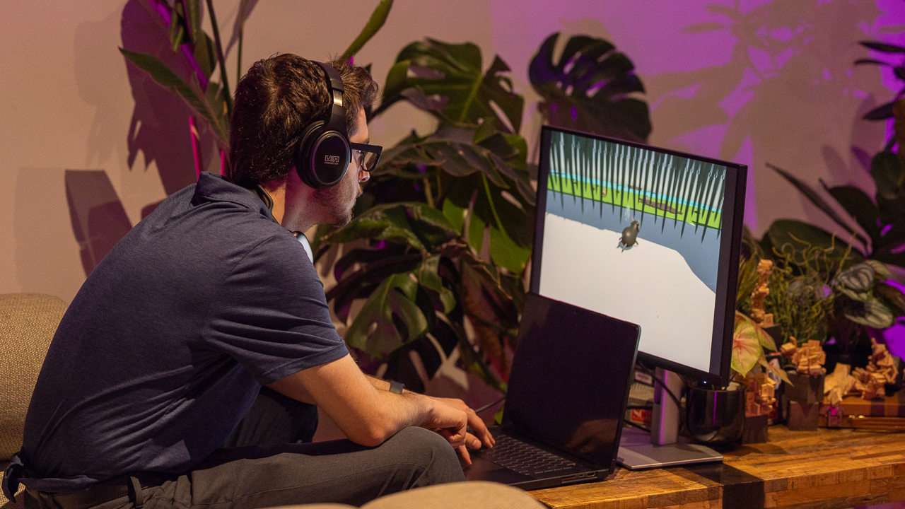Person wearing headphones playing HAS, a video game where the soundscape is shaped by different forms the character shifts into.