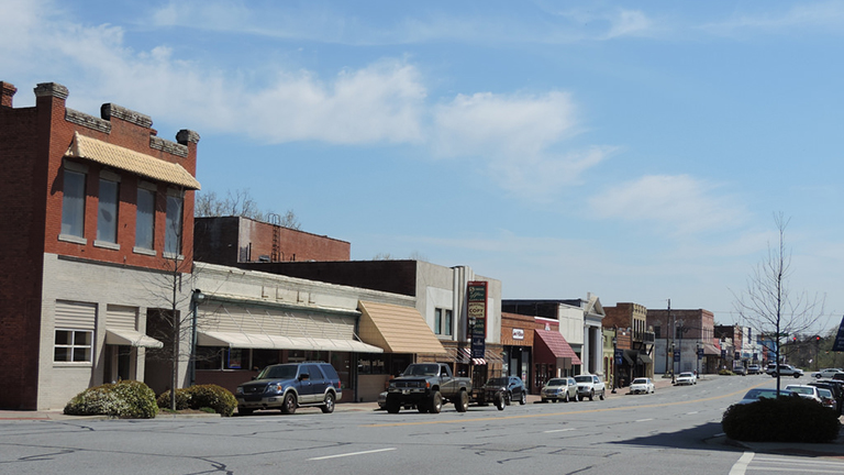 Street lined with buildings in Hawkinsville, Georgia.